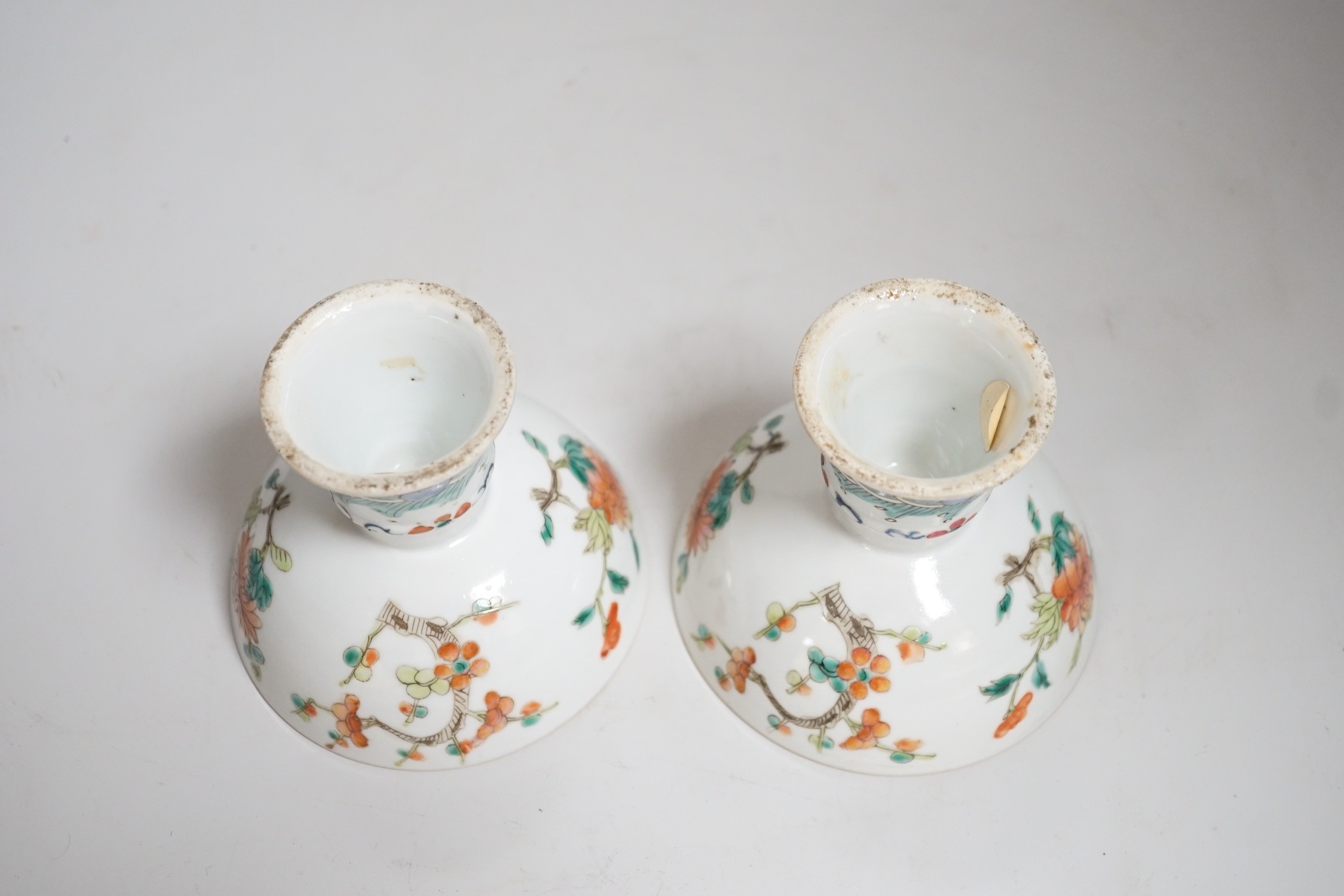 A pair of 19th century Chinese stem cups with four flower design, 9cm